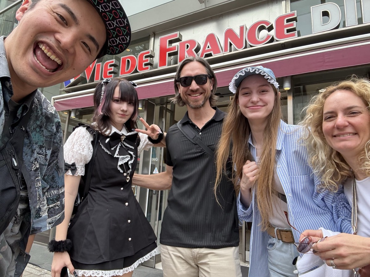 Yuuki with a tour group on the street in Akihabara