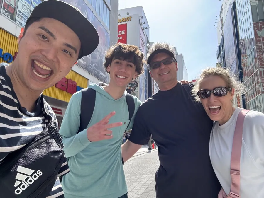 Your guide meeting guests on a sunny Akihabara street